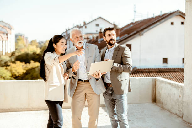 istock Couple Meeting Real-estate Agent 1349482782