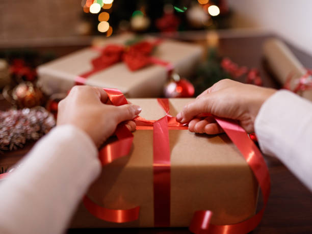 istock Woman wrapping Christmas presents 1349482913