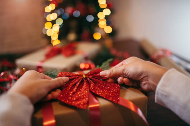 istock Woman wrapping Christmas presents 1349483122
