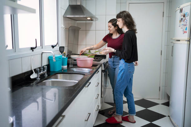 istock Lesbian couple cooking together. 1349483212