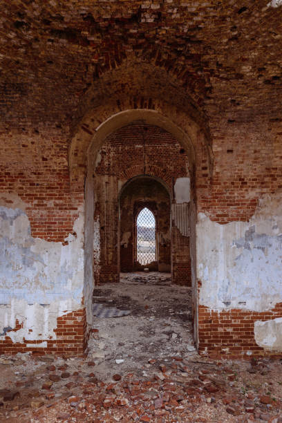 istock Inside the old ruined red brick church in gothic style 1349484314