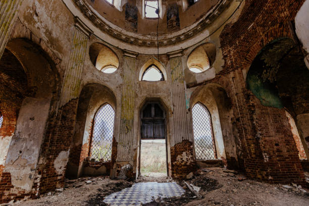istock Inside the old ruined red brick church in gothic style 1349484332