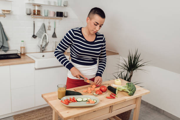 istock Woman preparing healthy meal 1349487961