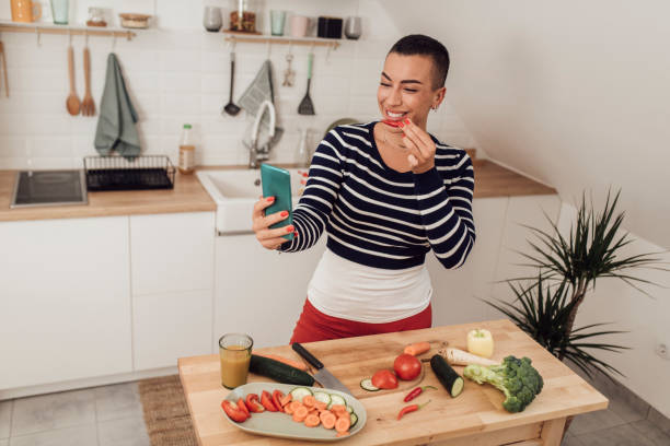 istock Woman taking selfie in kitchen 1349487964