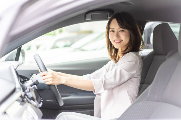 istock Business woman driving a car 1349489488