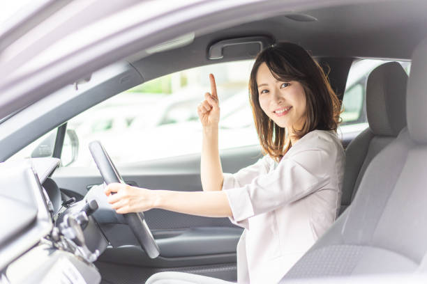 istock Business woman driving a car 1349489491