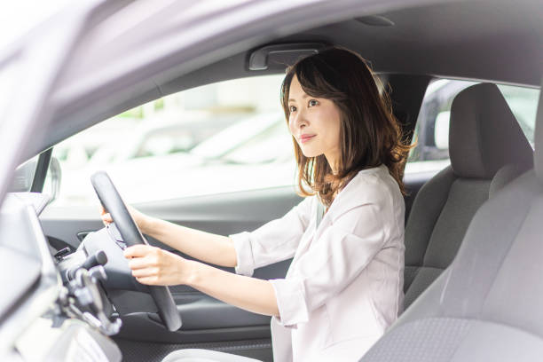 istock Business woman driving a car 1349489493
