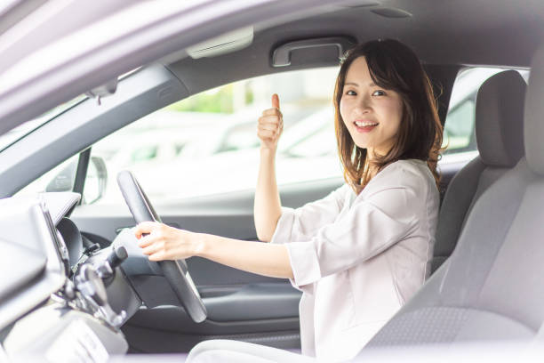 istock Business woman driving a car 1349489500