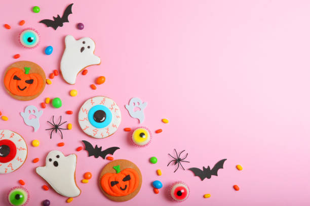 istock Halloween sweets on colored background close up top view with place for text 1349490145