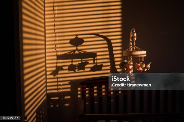 Baby Bedroom Stock Photo - Download Image Now - Crib, Hanging Mobile, Shadow