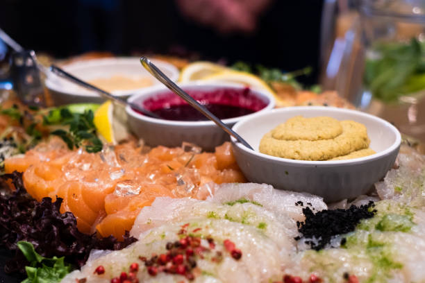 Gravlax salmon fillet, whitefish fillet, hummus, champagne jelly, blackcurrant-lemon sauce.