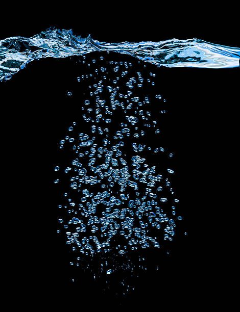 Water XXXL Blue bubbles on black background water on black surface stock pictures, royalty-free photos & images