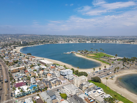 Aerial view of Mission Bay and beach in San Diego during summer, California. USA. Community built on a sandbar with villas, sea port and recreational Mission Bay Park.