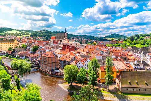 Panoramic view of Cesky Krumlov with St Vitus church in the middle of historical city centre. Cesky Krumlov, Southern Bohemia, Czech Republic