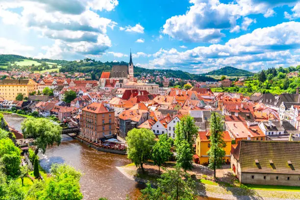Panoramic view of Cesky Krumlov with St Vitus church in the middle of historical city centre. Cesky Krumlov, Southern Bohemia, Czech Republic.