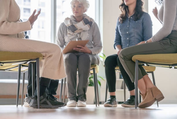 istock Ground View of a Group Therapy Session 1349504215
