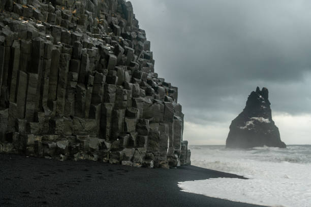 istock Basalt rock formations Troll toes on black beach. at storm Reynisdrangar, Vik, Iceland 1349513684