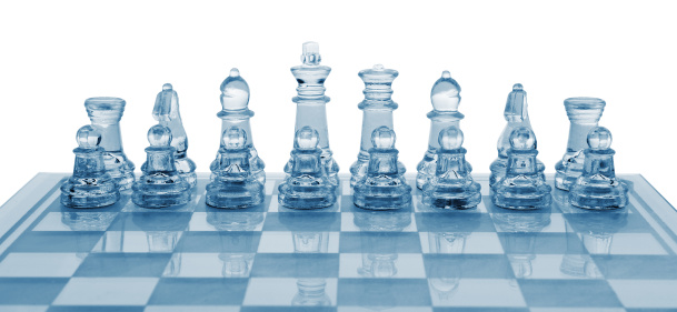 Glass chess. Blue toned. It is isolated on a white background.