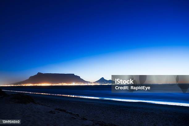 Table Mountain At Dusk Seen From Across Bay Stock Photo - Download Image Now - Africa, Beach, Beauty In Nature