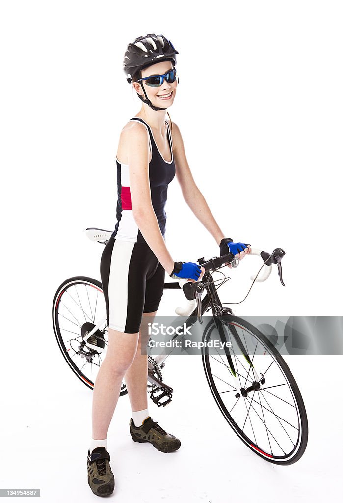 On yer bike Young woman with a high-end road racer worth thousands of dollars. She's wearing proper cycling shoes, gloves, helmet and sunglasses. Camera: Canon EOS 1Ds Mark III. Cycling Stock Photo