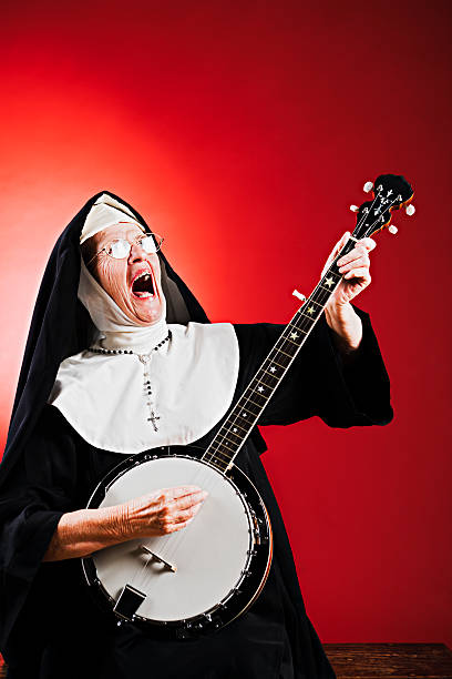 Following the tradition of singing nuns, this old religious woman enjoys singing to her banjo! Shot with Canon EOS 1Ds Mark III.