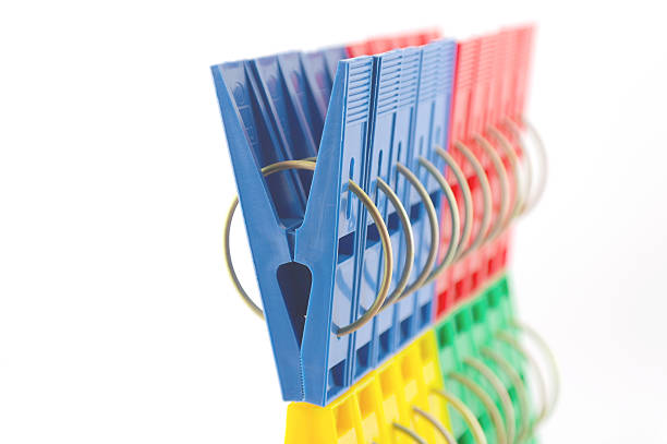 istock Color clothes-pegs over white 134955559