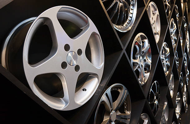 Alloy wheel Fancy rims on a big rack in a specialist store. car for sale stock pictures, royalty-free photos & images