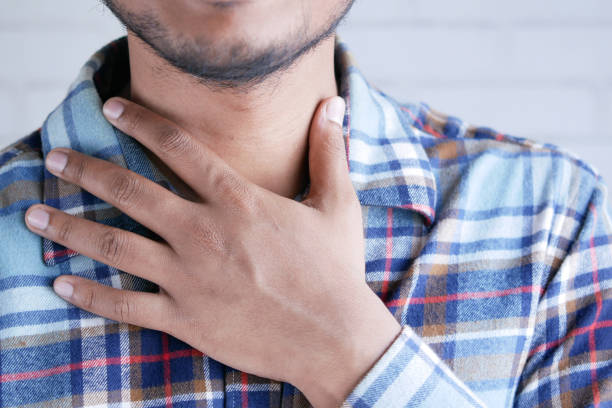istock unrecognized man suffering throat pain close up 1349559740