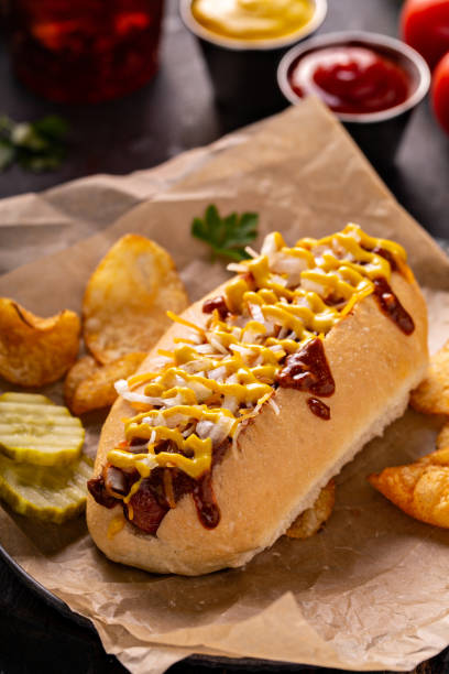 istock Chili hot dog with onion and mustard 1349560412