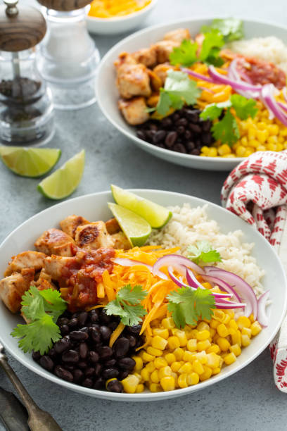 istock Mexican burrito bowl with salsa chicken and beans 1349560436