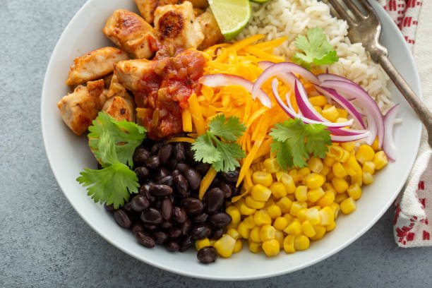 istock Mexican burrito bowl with salsa chicken and beans 1349560443