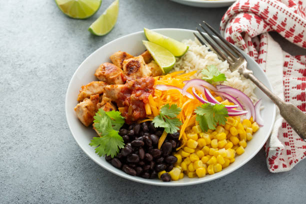 istock Mexican burrito bowl with salsa chicken and beans 1349560448
