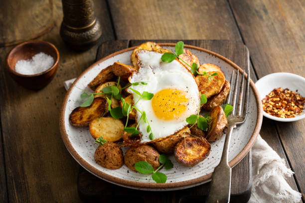 istock Air fried new potatoes topped with egg 1349560790