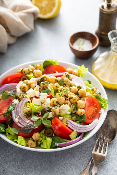 istock Healthy spring Greek salad with fresh vegetables and chickpeas 1349560816