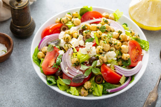 istock Healthy spring Greek salad with fresh vegetables and chickpeas 1349560819