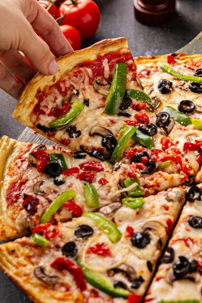 istock Vegetarian pizza with peppers, mushrooms and olives 1349560849