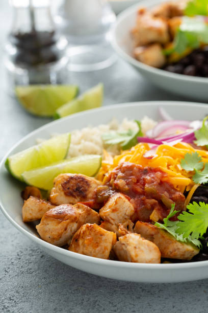 istock Mexican burrito bowl with salsa chicken and beans 1349560876