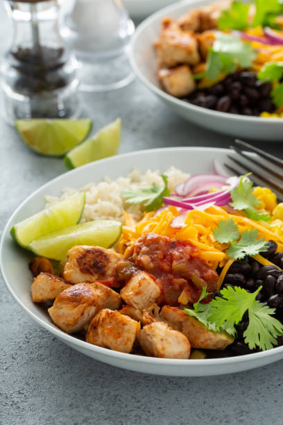 istock Mexican burrito bowl with salsa chicken and beans 1349560882