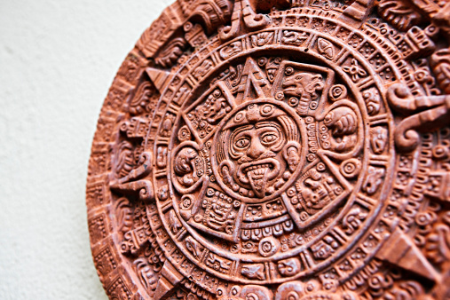 The Aztec calendar stone known as the Stone of the Sun. The original, carved in basalt, was excavated in Mexico City in 1790. This is a modern ceramic reproduction. The stone has become an informal national symbol of Mexico. Shot with EOS 1Ds Mark III.