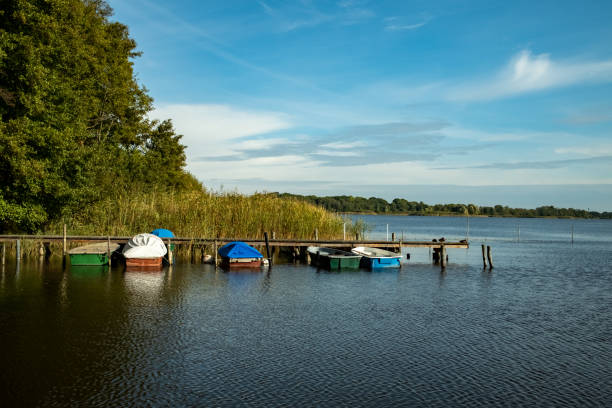 istock out of a forest comes a long jetty into a lake 1349577694