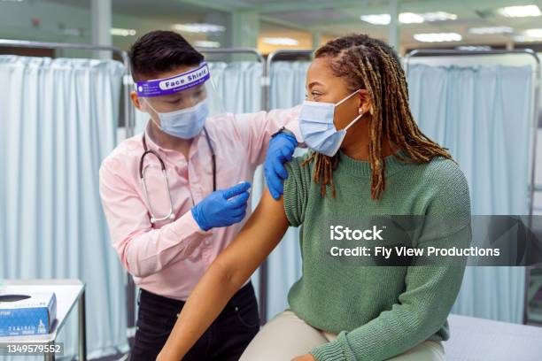 Black Woman Receiving Covid19 Vaccination Injection Stock Photo - Download Image Now
