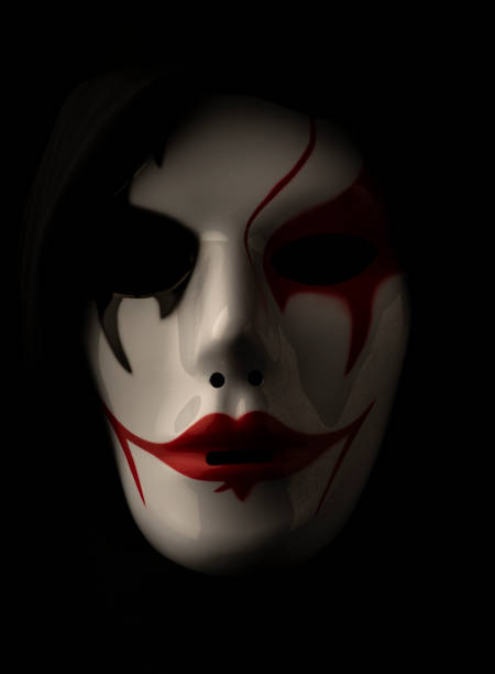 istock Scary mask for Halloween hand sprayed by photographer with dramatic lighting and black background 1349579624