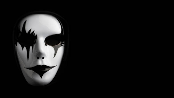 istock Scary mask for Halloween hand sprayed by photographer with dramatic lighting and black background 1349579625