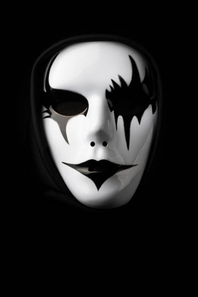 istock Scary mask for Halloween hand sprayed by photographer with dramatic lighting and black background 1349579628