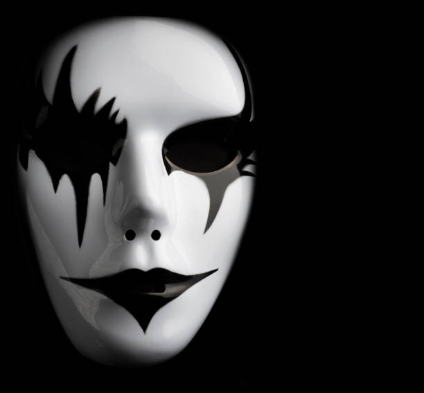 istock Scary mask for Halloween hand sprayed by photographer with dramatic lighting and black background 1349579639
