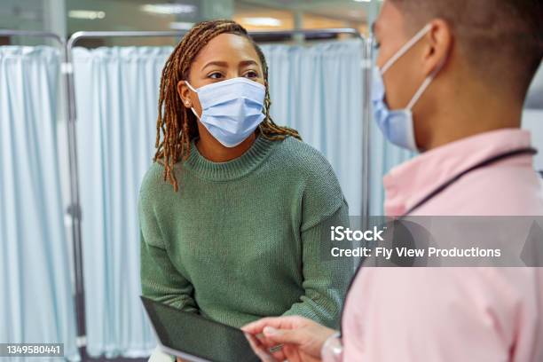 Black Woman Having Medical Consultation With Doctor Stock Photo - Download Image Now