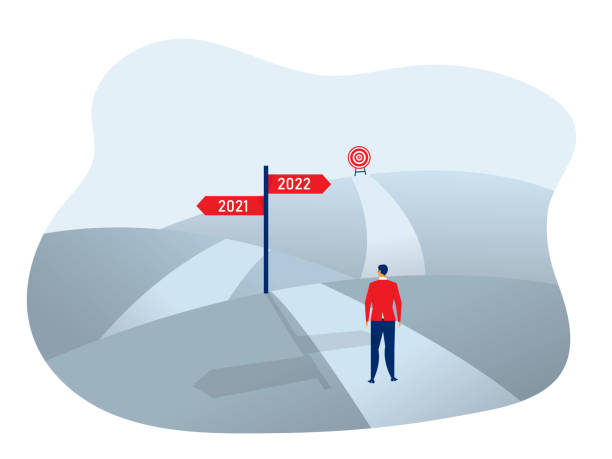 istock A Businessman standing on the asphalt road over the hills,Decide direction toward goal 2021 vector illustrator. 1349583870