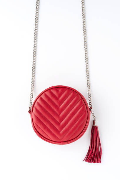 istock Red elegant shoulder bag isolated on white background. Flat lay 1349584042