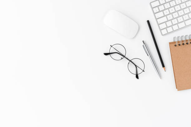 istock Elegant workspace with financial accessories isolated on white background with copyspace. Office desktop 1349584061