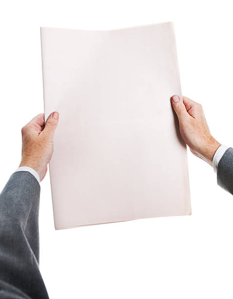 istock Businessman's hands hold blank newspaper ready for your headlines 134958450